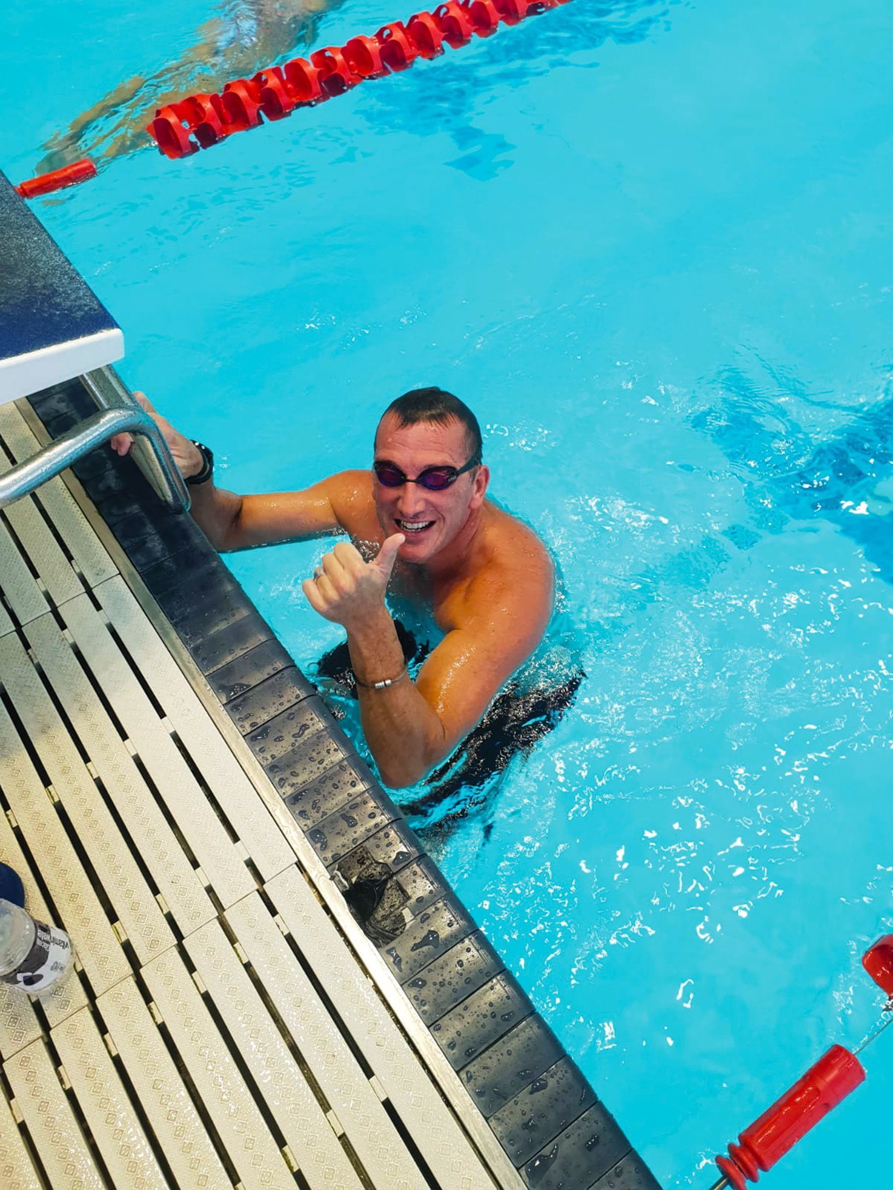 Callum Eade, person training in swimming pool