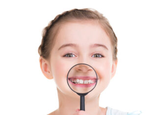 Girl showing healthy teeth