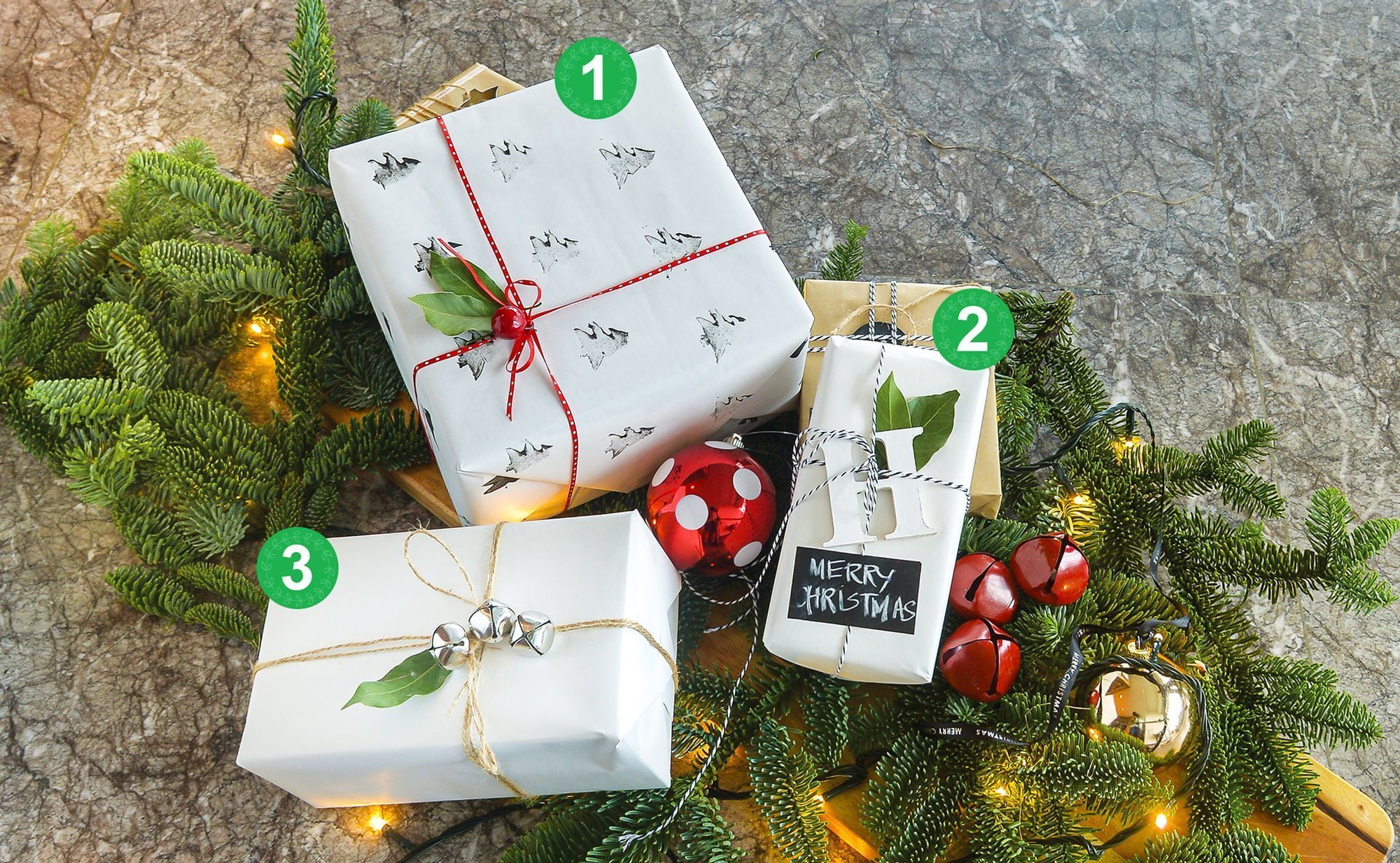Christmas-present-wrapping-selection-of-white-wrapped-presents-on-pine