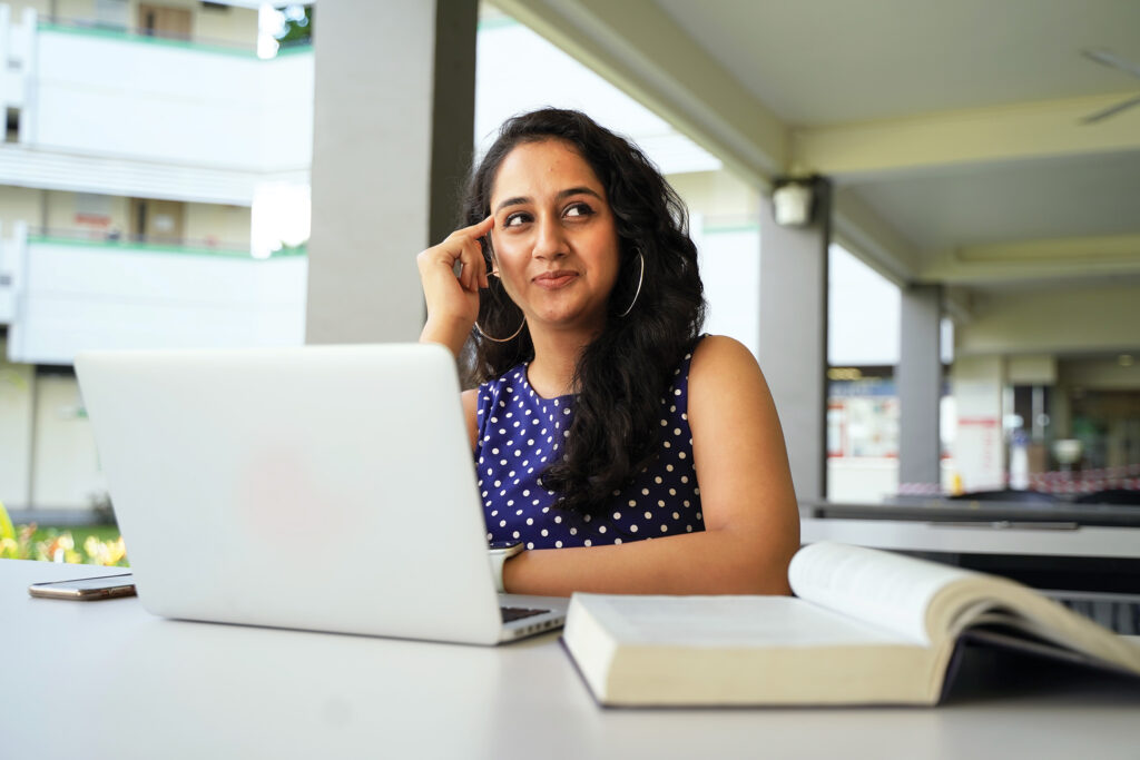 James-Cook-University_Woman-sitting-at-desk-in-workplace-thinking