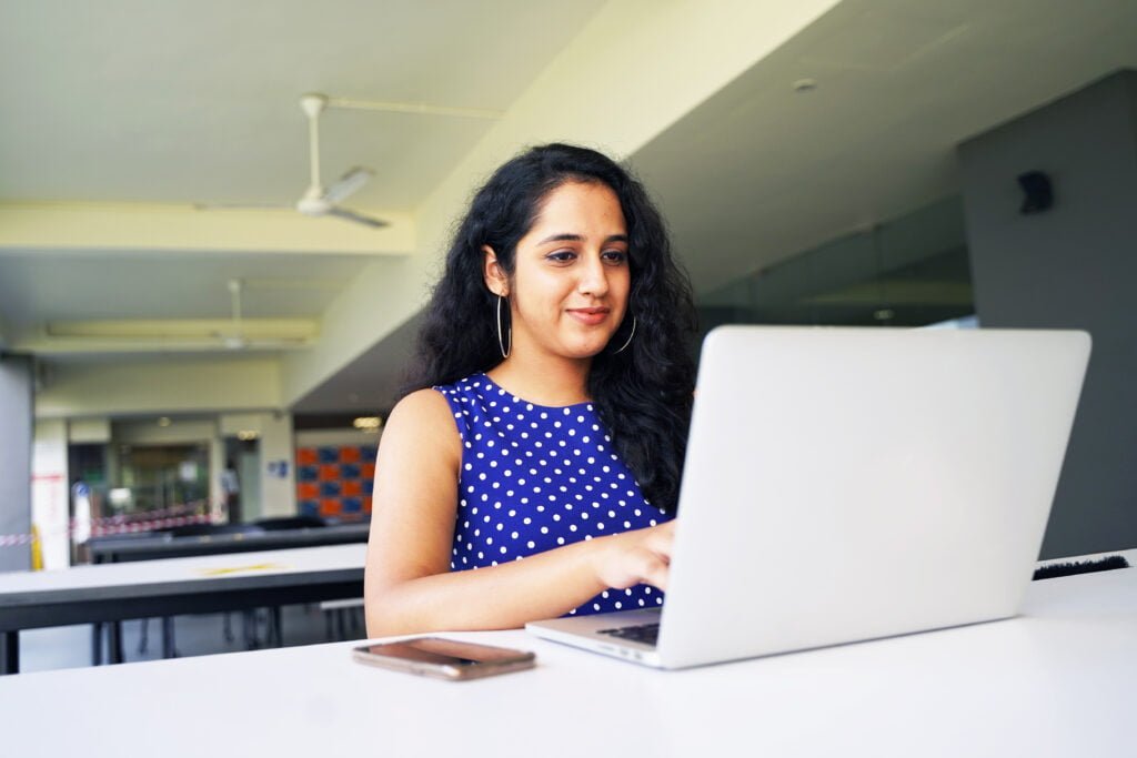 JCU_Empowering people to tackle cyber threats_Woman sitting at computer