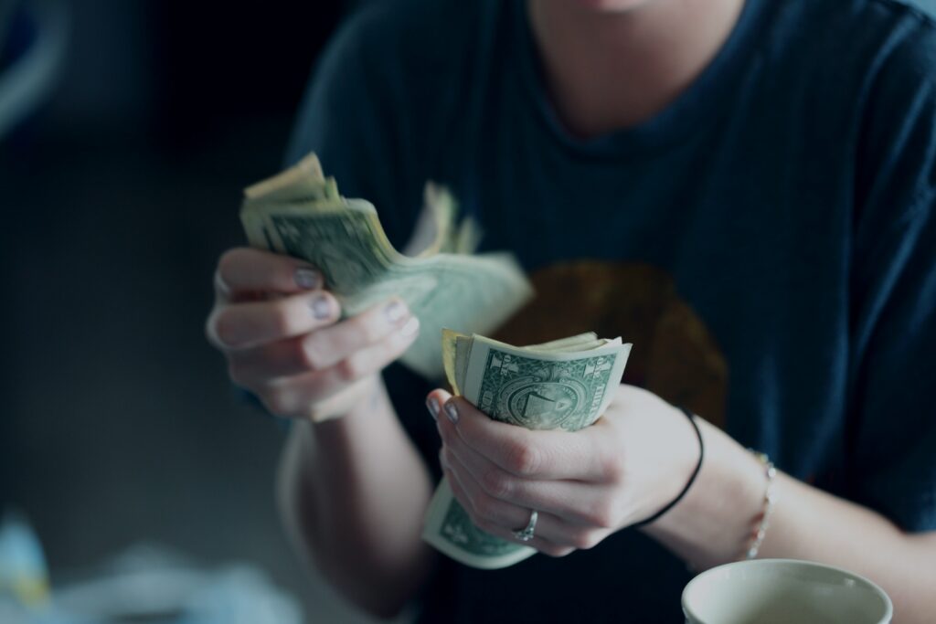 Women_money_investments_female-hands-holding-money