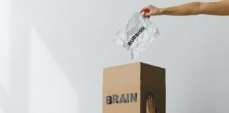 Woman-with-box-on-head-rubbish-going-in