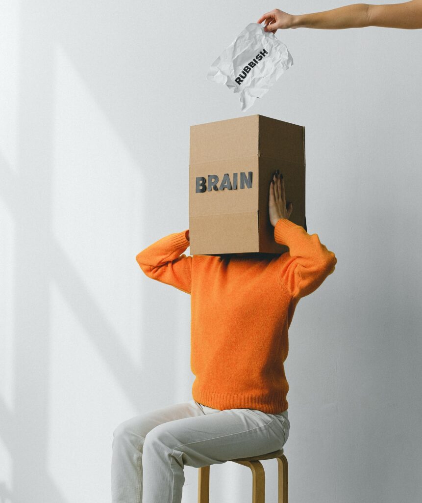 Woman-with-box-on-head-rubbish-going-in