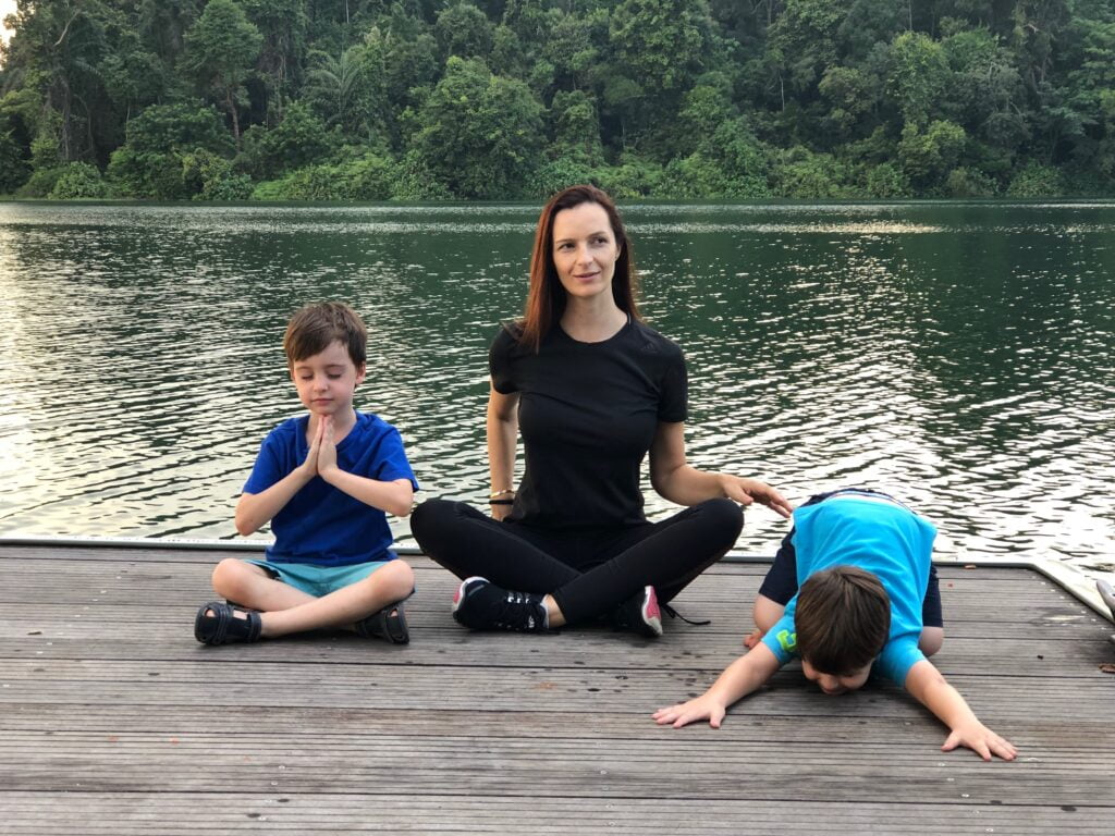 Isabel Galiano with boys on yoga deck