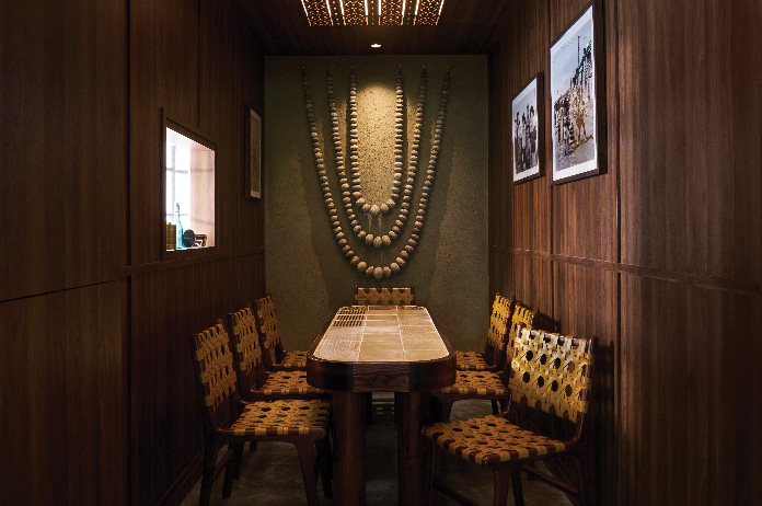 Magpie Tiong Bahru restaurant interior with wooden finishes, woven chairs, and New Zealand-inspired décor.