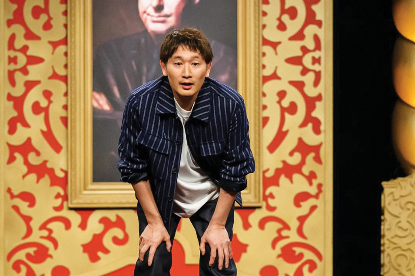 Japanese-Australian comedian Takashi Wakasugi on stage