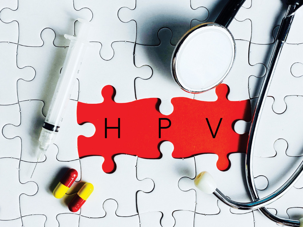Puzzle pieces form "HPV" with medical tools, highlighting vaccine importance.