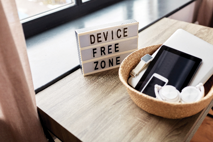 Embracing peace by disconnecting from digital devices.