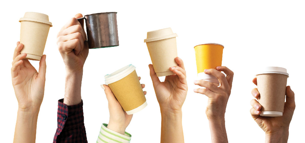 Hands holding coffee cups of various sizes