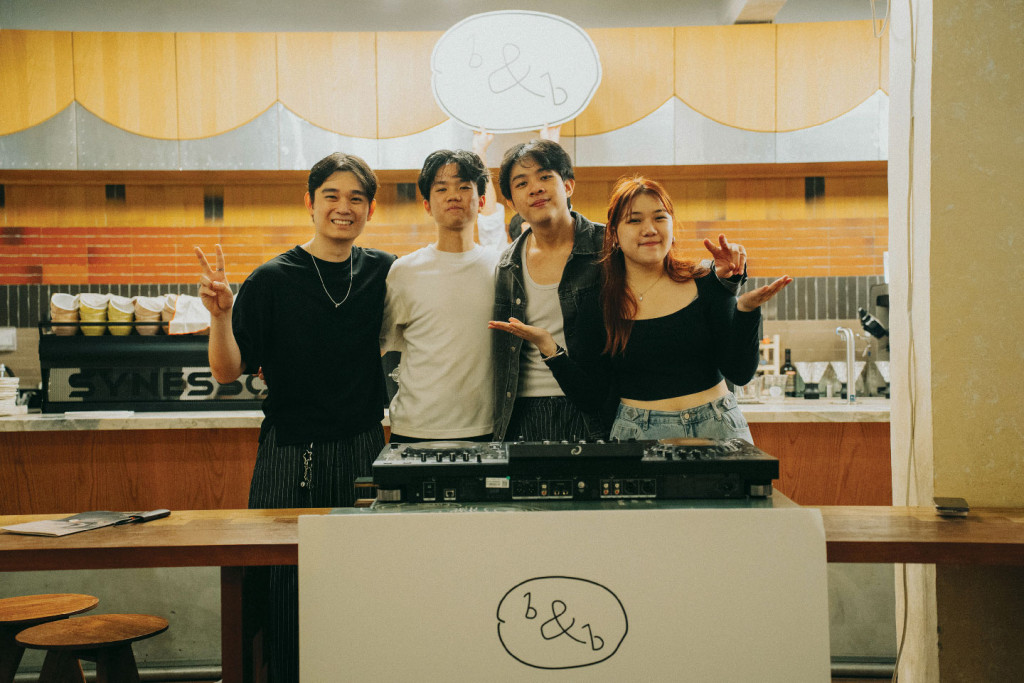4 youths standing by a coffee counter