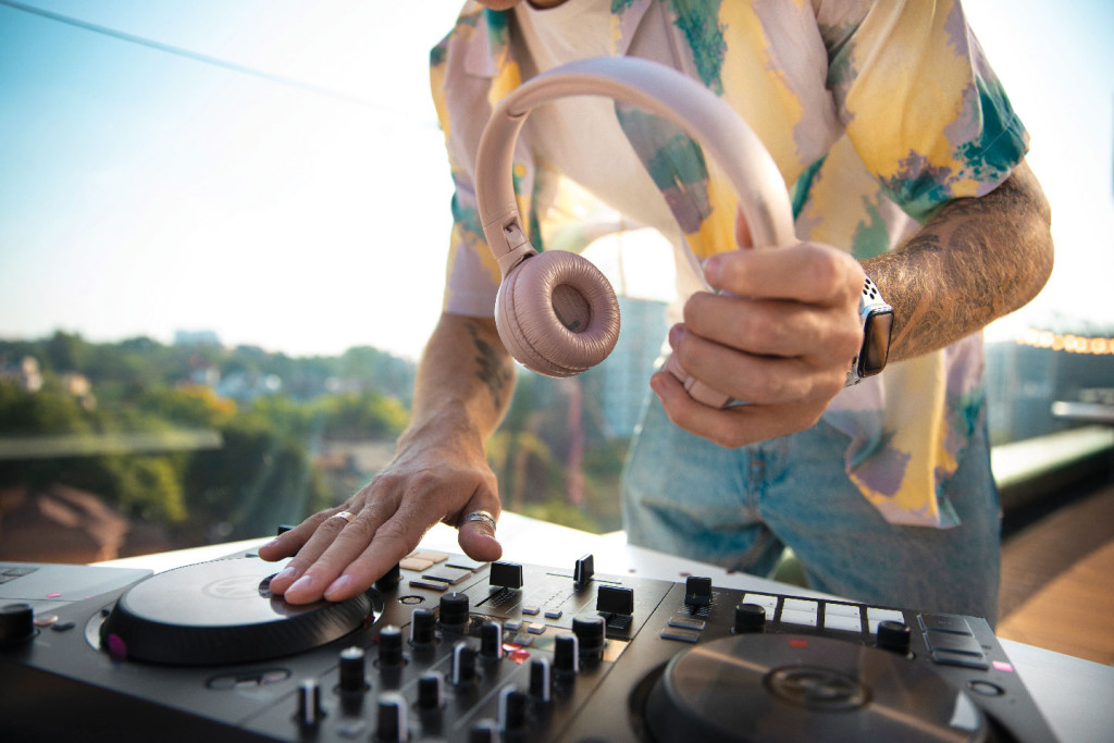 DJ on roof during daylight