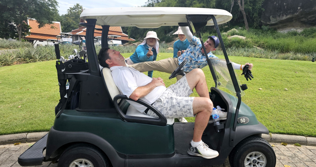 Man asleep on golf buggy