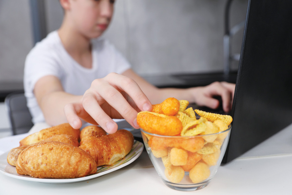 Youth eating chips